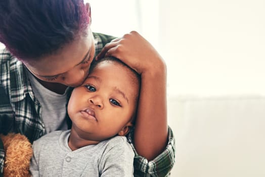 Shot of a mother cradling her little baby boy.