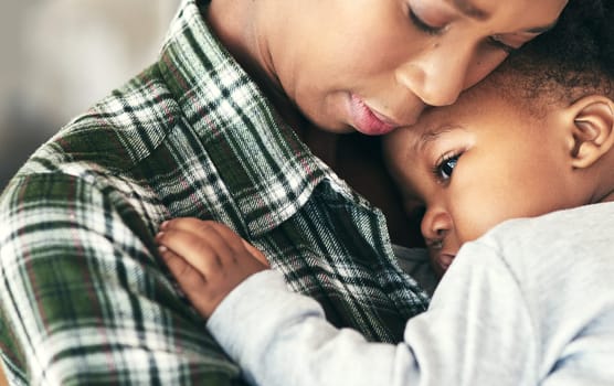 Shot of a mother cradling her little baby boy.