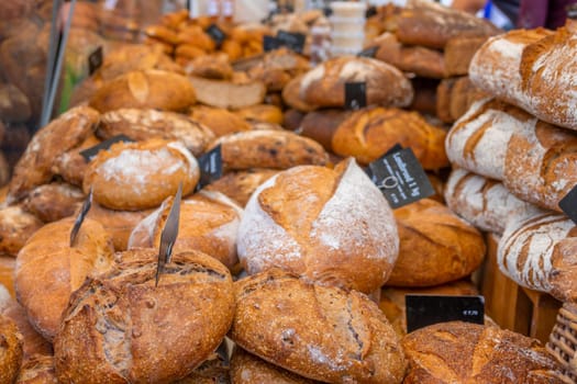 Netherlands. Farmers market in Amsterdam. Many loaves of fresh bread close-up