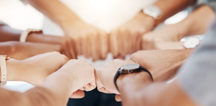 Group, circle and fist bump with team building closeup, community or collaboration for goals in office. Business people, synergy and productivity with solidarity, agreement or networking in workplace.