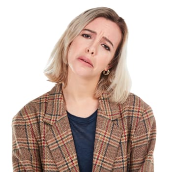 Portrait, sad or white background and a woman isolated in studio with an unhappy or negative expression. Face, sadness and depression with an unhappy young female posing on blank branding space.