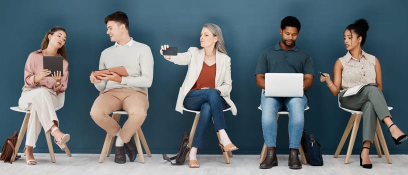 Hiring, technology and business people waiting for job interview, vacancy and opportunity in office. Recruitment, diversity and men and women on phone, tablet and laptop to prepare for hr meeting.