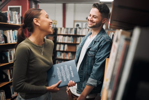 Man, woman and talking in library, knowledge and bonding with smile. Young female, male and students in bookstore, education and book for learning, studying or conversation for literature and novels