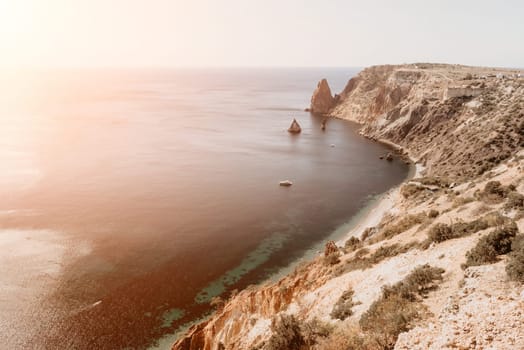 Aerial panoramic view of beautiful sunset above sea. Beautiful seascape. Sun glare, small waves on the water surface. Evening. Horizon. Nobody. No people. Copy space. Never-ending beauty of nature