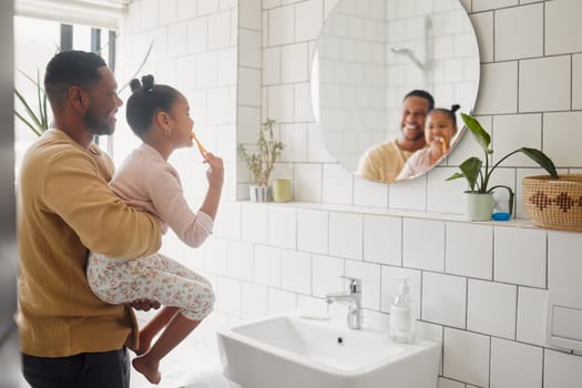 Brushing teeth, father and child in home bathroom for dental health and cleaning in mirror. African man, girl kid or learning to clean mouth with toothbrush for morning fun, oral hygiene or self care.