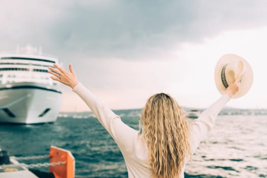 Woman tourist standing in front of big cruise liner, travel female.