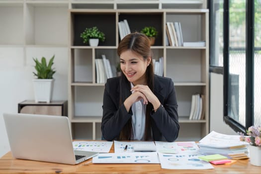 Business woman, portrait and smile at desk in office for paperwork, laptop. Happy young or confident female worker with pride planning project at table in startup company.