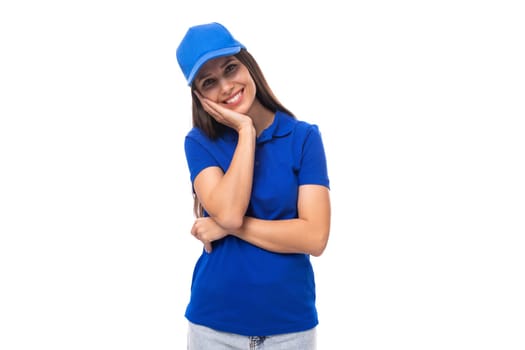 merch design concept. smiling young woman in blue t-shirt and cap on white background with copy space.