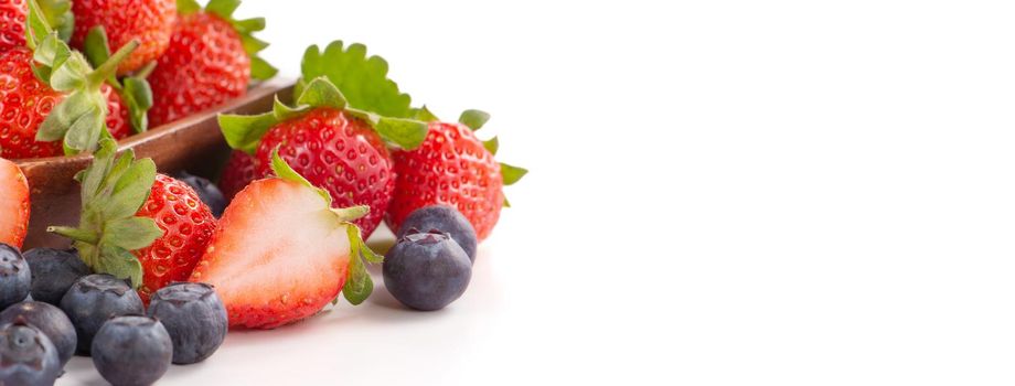 A bowl set of beautiful and delicious strawberry and blueberry isolated on white background, close up, copy space, clipping path, cut out.