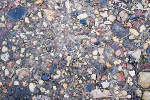 Background of small stones on the sand close up