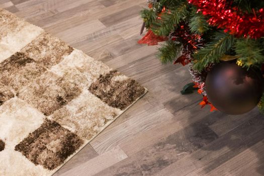 Toys on a Christmas tree on a wooden floor background