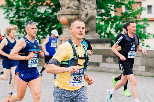 Prague, Czechia - 7th May 2023 - Runners of Prague Half marathon in the city streets.