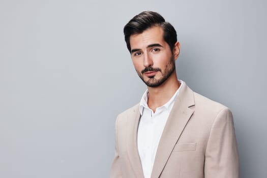 man businessman business beige standing corporate handsome happy posing smiling suit isolated grey formal background fashion sexy portrait copyspace attractive white