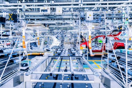 Assembling cars on conveyor line in a car plant