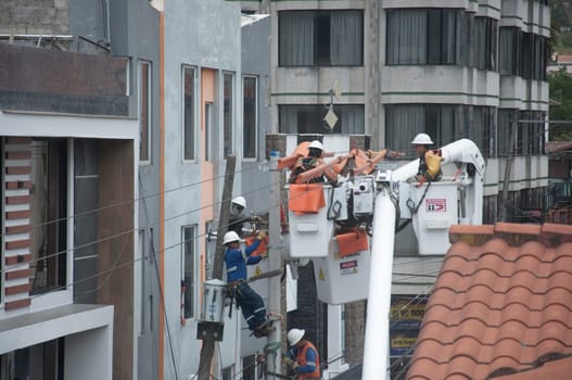 team of electrical engineers safely protected in a high voltage maintenance. High quality photo