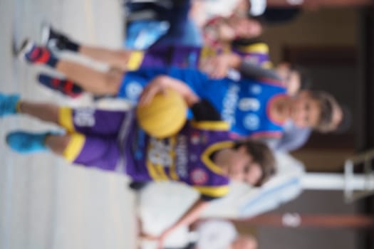 Blurred Shot of Teenage Basketball Player with Ball Launching an Attack