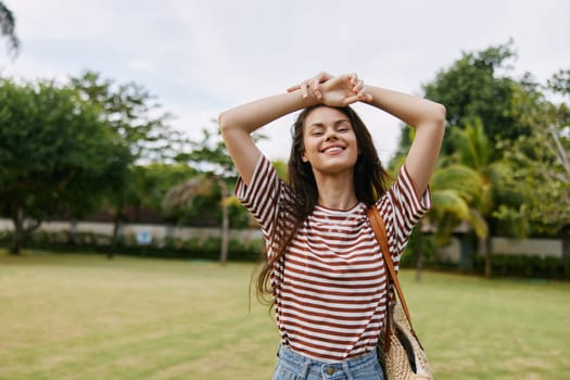 woman smile active summer walk smiling park bali natural t-shirt exercise day fun hipster lifestyle grass beautiful girl nature happiness freedom