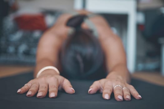 Even the gentlest forms of yoga are transformative. a young woman practising yoga at home