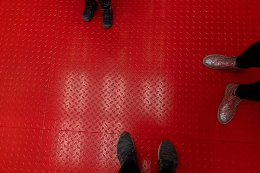 metal red painted surface floor view on feet. High quality photo