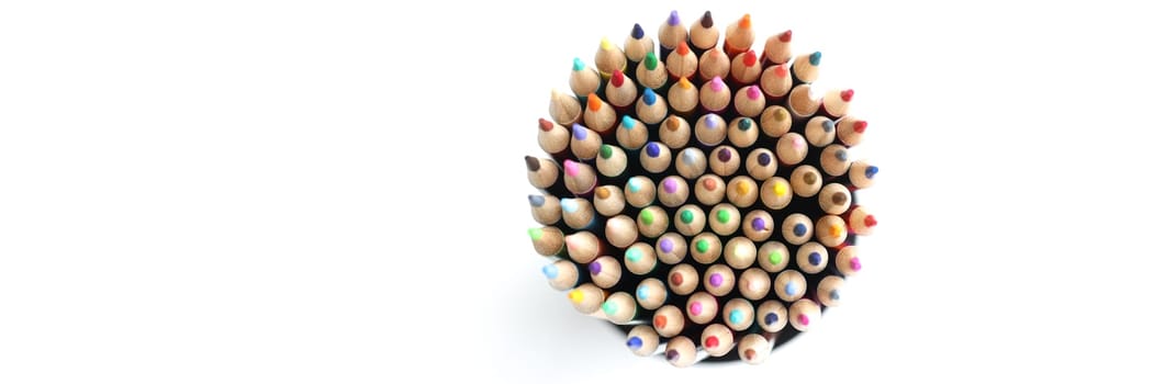 Colored pencils circle on white background from above. Colored pencils for drawing concept