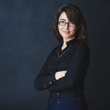 You have more potential than you believe. Studio portrait of a corporate businesswoman posing against a dark background