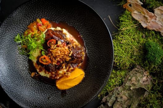 Exquisite serving of beef cheeks with couscous risotto