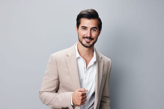 man business isolated smile smiling suit occupation copyspace shirt posing arm young businessman portrait professional executive entrepreneur grey beige handsome happy