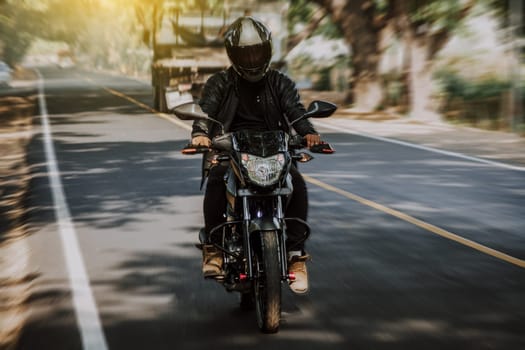 Motorcyclist driving at high speed on the street. Motorcycle driver at full speed on the highway.