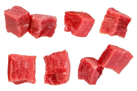 Pieces of raw beef. Set of fresh beef cubes isolated on white background. Isolate of beef cubes to insert into a design, project or for an advertising banner. High quality photo