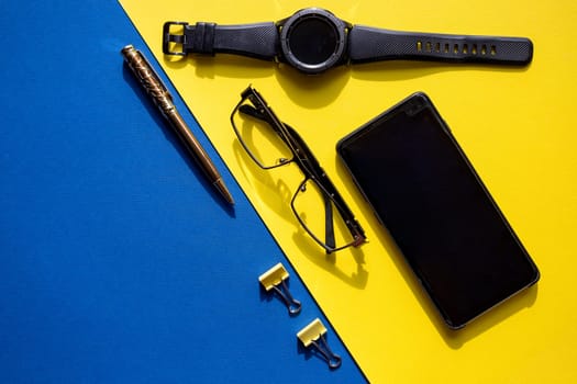 Outfit of traveler, businessman or student. Smartphone, sleep mask, glasses, watch, mp3 player
