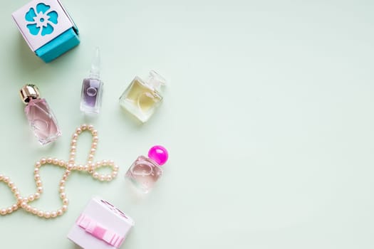 Beauty blog concept. Accessories, flowers, cosmetics and jewelry on pink background, copyspace. Womens Day concept
