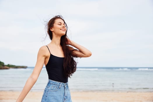 woman beautiful enjoyment sea beach sky smile young dress summer sunlight walking vacation running nature water sun sand ocean free carefree