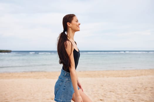 woman ocean sunrise female vacation relax sea active summer walking young hair water running smile beach lifestyle long flight sunset travel body