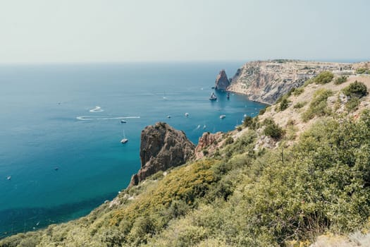 Aerial panoramic view of beautiful sunset above sea. Beautiful seascape. Sun glare, small waves on the water surface. Evening. Horizon. Nobody. No people. Copy space. Never-ending beauty of nature