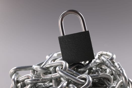 Control lock and chain on gray background. Lock account password or database concept