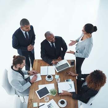 Feedback is simply the art of great communication. High angle shot of a group of businesspeople having a meeting