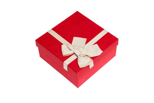 Red gift box with gold ribbon and bow isolated on white background.