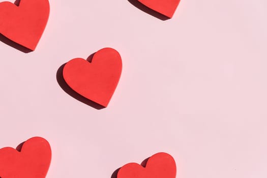 Valentine's Day background. White and red hearts on pastel blue background. Valentines day concept. Flat lay, top view, copy space