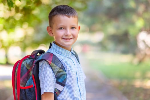 Back to school. A little boy goes to school on the day of the beginning of the term. Beginning of lessons.