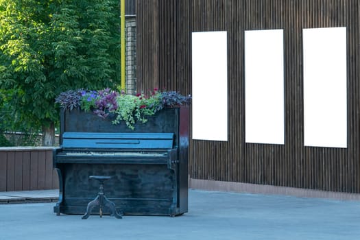 piano in the park with a place for advertising. photo