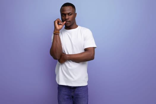 pensive 30s african man with short haircut in white tank top reasoning.