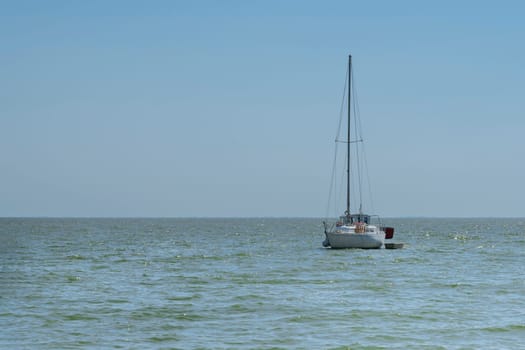 yachts on the water against the blue sky. photo