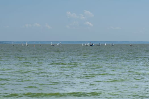 yachts on the water against the blue sky. photo