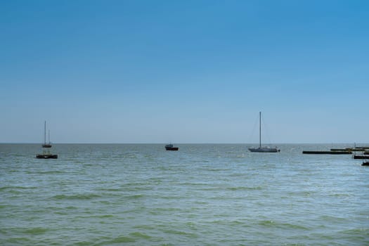 yachts on the water against the blue sky. photo