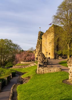 Ancient stone castle walls with keep overlooking river in Knaresborough near Harrogate in Yorkshire