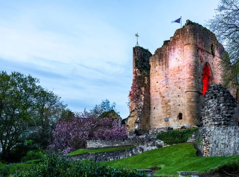 Ancient stone castle walls with keep overlooking river in Knaresborough near Harrogate in Yorkshire