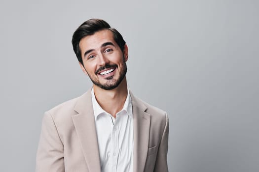 male man grey smile professional businessman happy copyspace handsome beige fashion background isolated smiling business job portrait entrepreneur stylish office suit