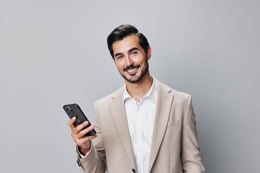 suit man smartphone technology business smile selfies phone holding guy mobile happy isolated mobile hold gray trading phone young portrait male call