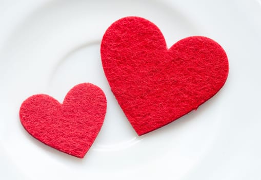 Red hearts on a plate close-up. Valentine's Day.