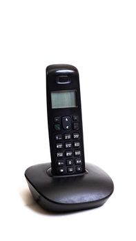 Old handset of cordless landline phone isolated on a white background close up